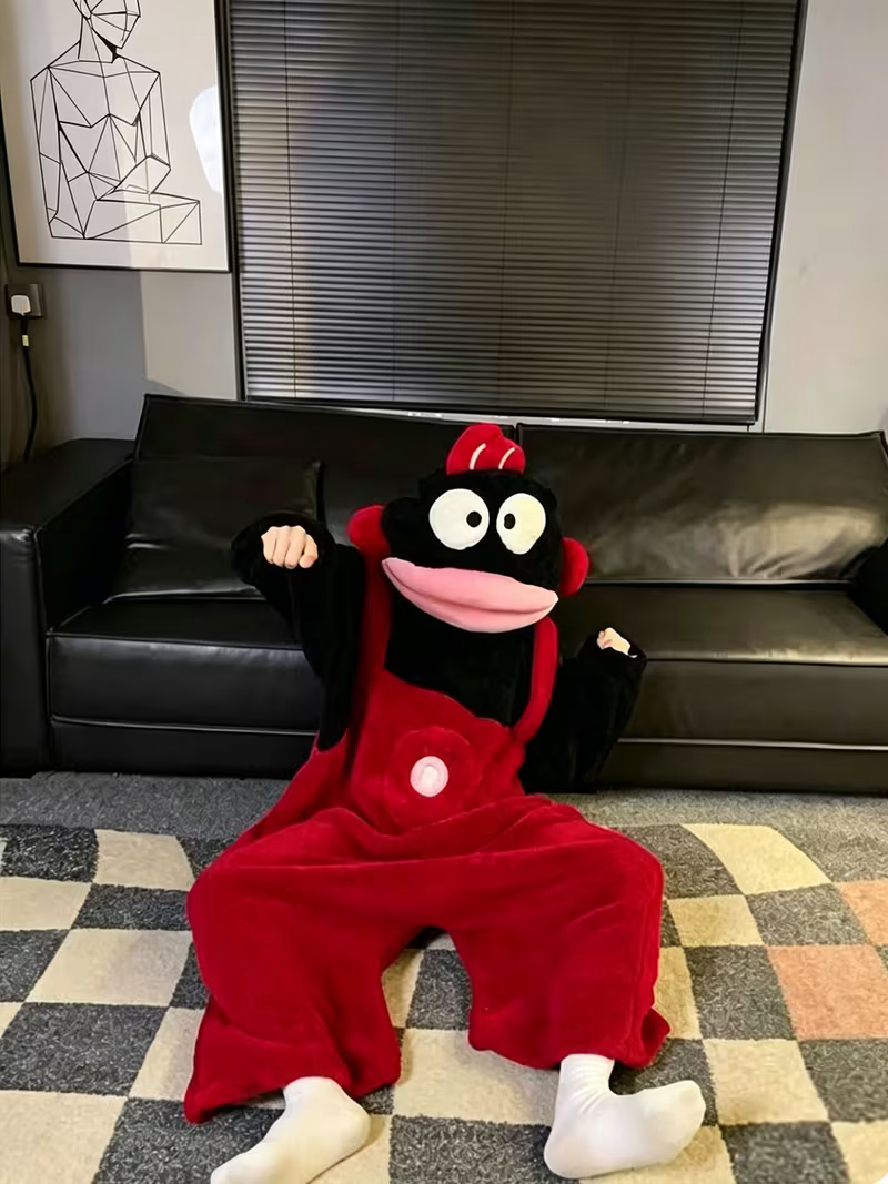 Onzis black monkey onesie worn with the hood up