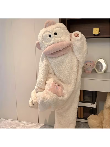 Onzis cream monkey onesie beside a shelf of plush toys